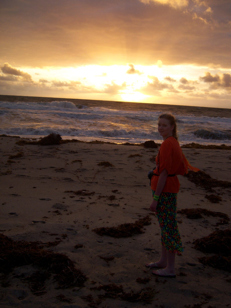 Leiajoy Fitzgerald wearing her amazing mutating skirt, a crochet project gone wrong, on the beach at a business conference in Florida