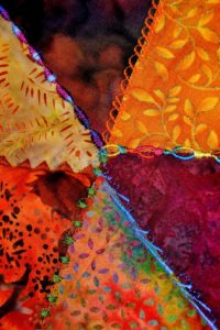 Criss-crossing seams in an autumn crazy quilt